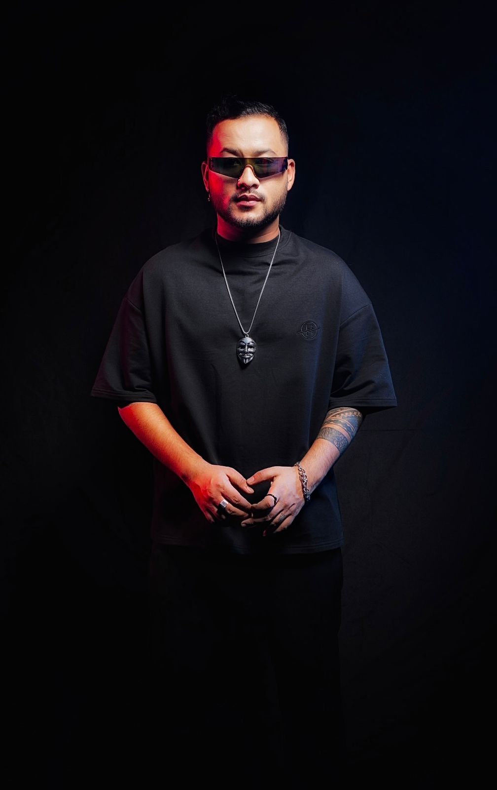 DJ Nihan full-length studio portrait in all black